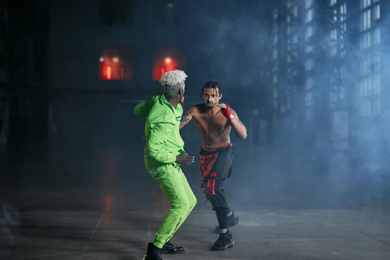 two men in neon clothes are in the street