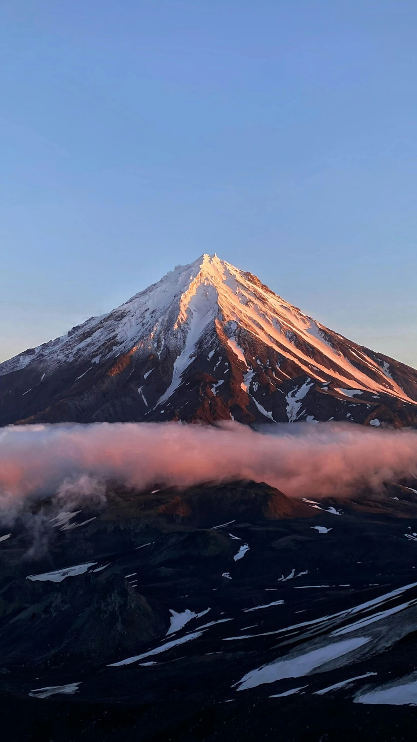 an aerial view of a large snow covered mountain