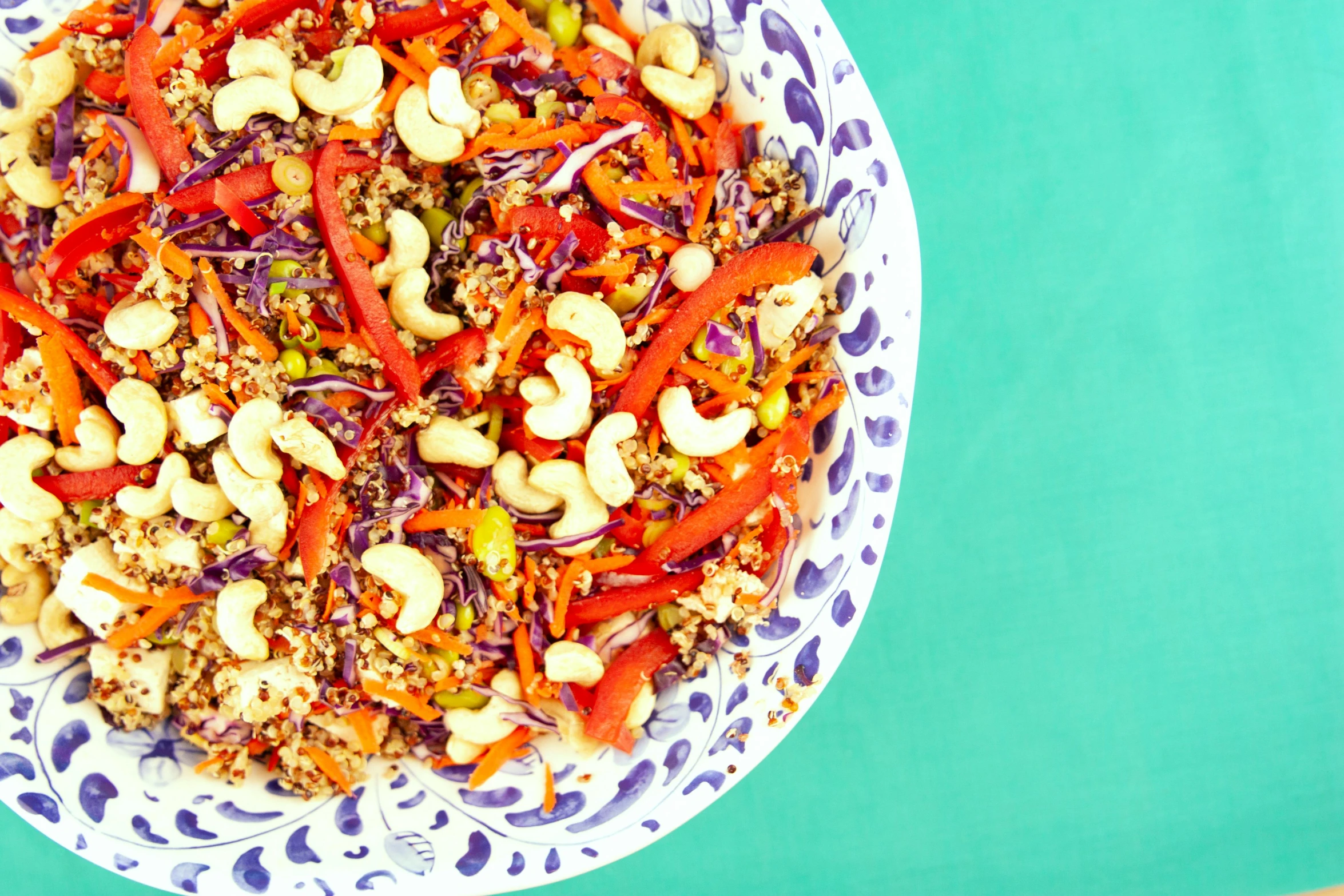 a close up of a plate of food on a table, by Julia Pishtar, super colorful, luscious with sesame seeds, bowl filled with food, justina blakeney