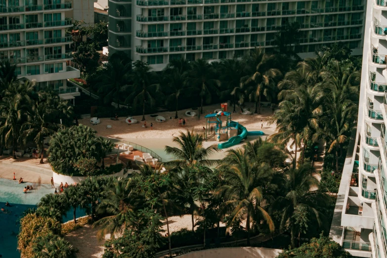 an aerial s of people at a beach in front of a el