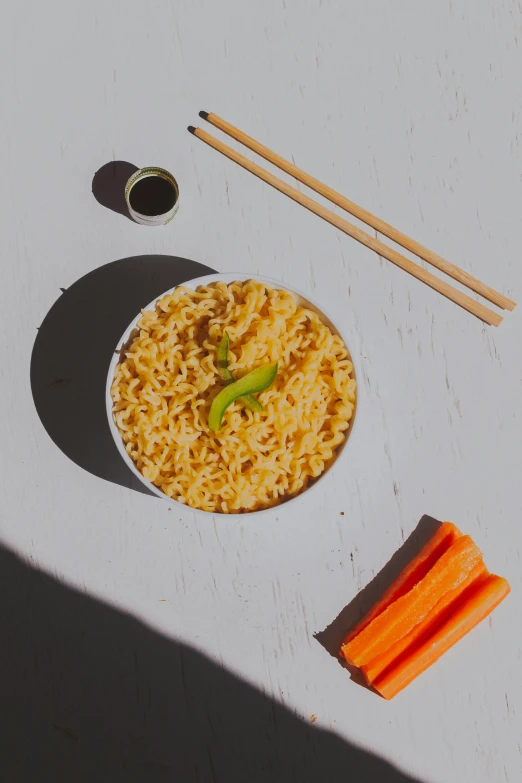 a bowl of noodles with carrots and chopsticks, unsplash, realism, detailed product image, sun drenched, 2 dimensional, rice