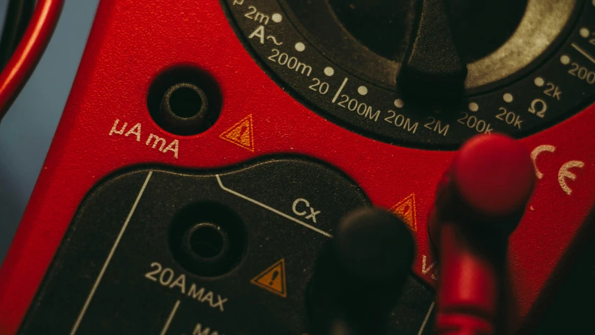 a close up of a digital multimeter, a picture, by Adam Marczyński, trending on pexels, red, camera looking down into the maw, banner, portrait shot