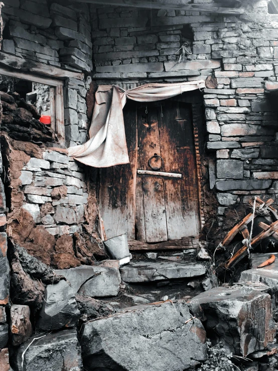 a black and white po with the door on top of rocks