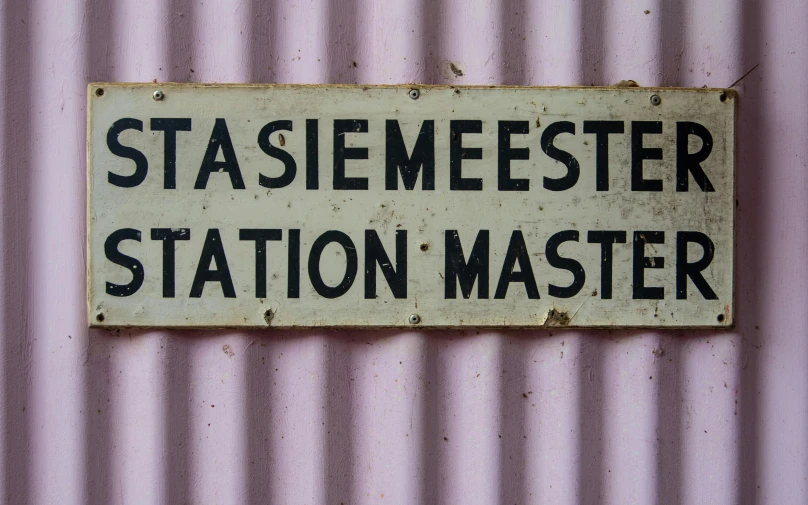 a sign that is on a wall saying staeemester station master