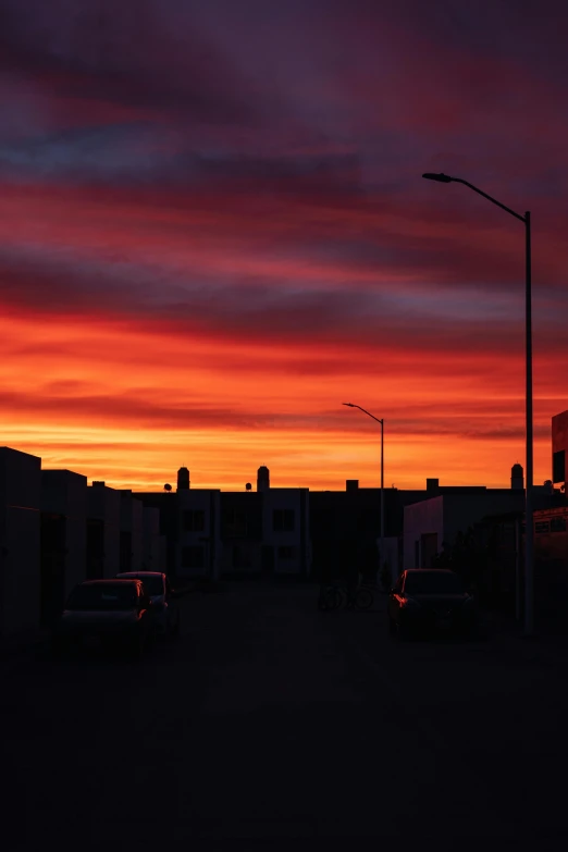 a street light under a very colorful sky