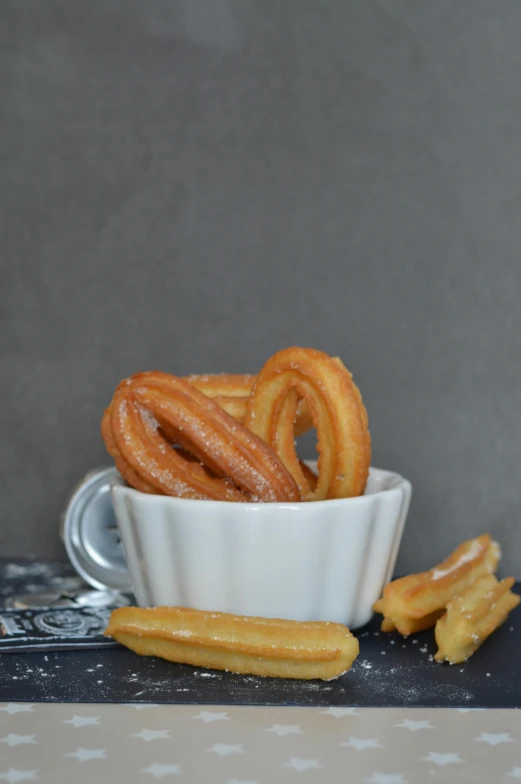 there is some onion rings sitting in a bowl