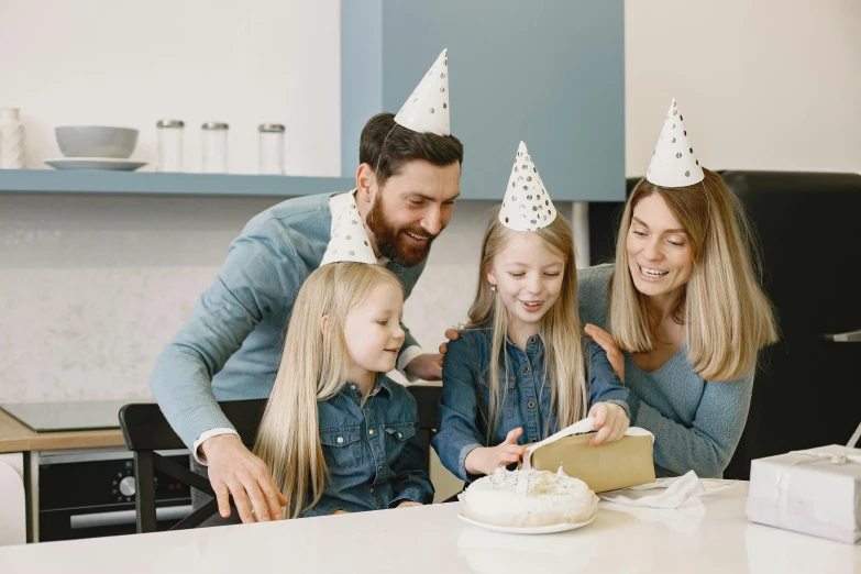 a family celebrating a birthday with a cake, pexels contest winner, wearing a grey wizard hat, 15081959 21121991 01012000 4k, perfect android girl family, unique design