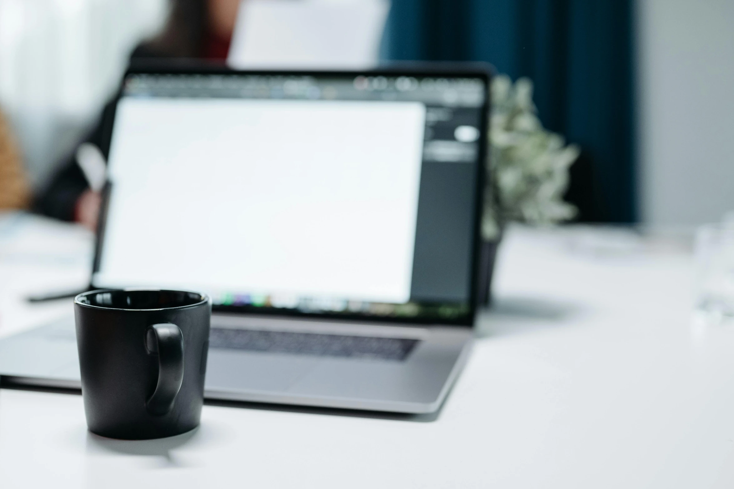 a laptop computer sitting on top of a white table, by Carey Morris, trending on pexels, next to a cup, black interface, no - text no - logo, thumbnail