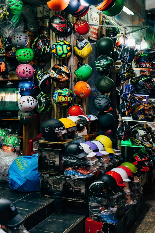 a shop full of different helmets and hats