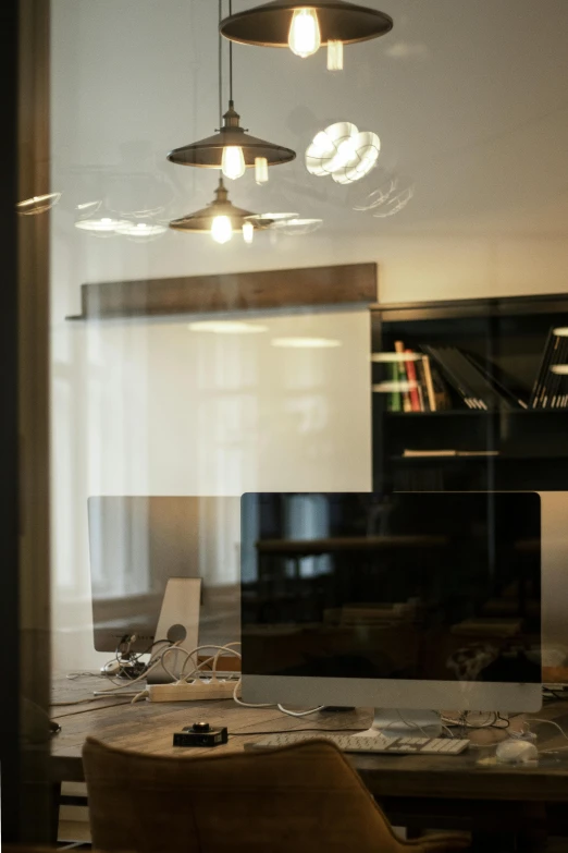 the view of a computer screen and table from across the room