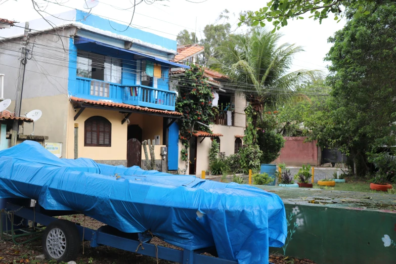 a building with a blue tarp on top of it