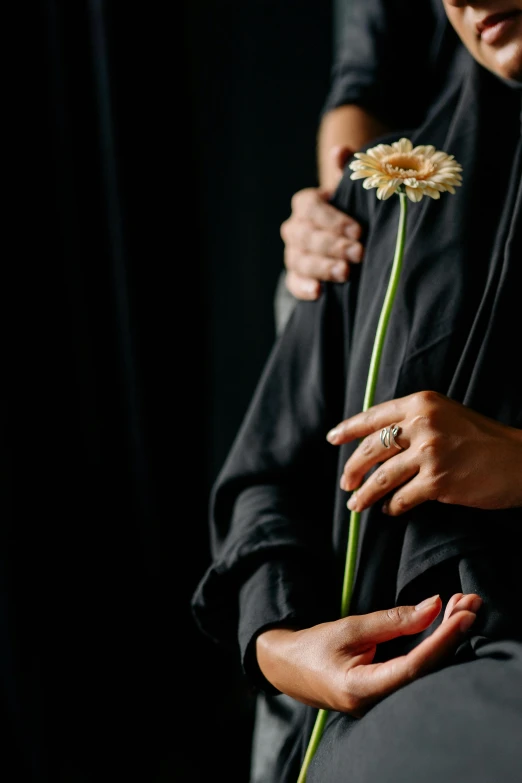 a close up of a person holding a flower, an album cover, wearing black clothes, holding each other hands, dark. no text, profile image