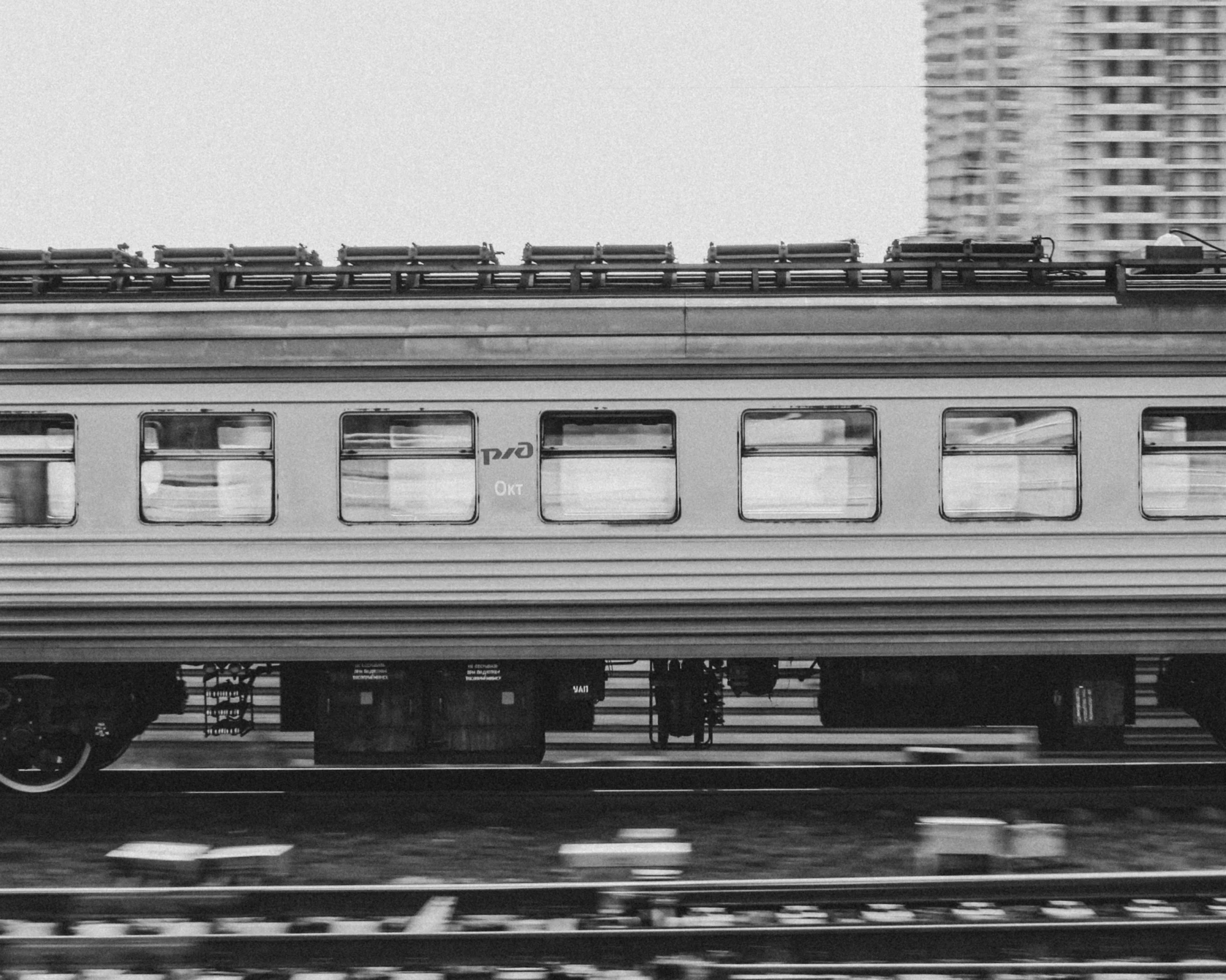 a black and white photo of a train on the tracks, a black and white photo, unsplash, supersonic trains and passengers, carriage full of computers, featured, stylized photo