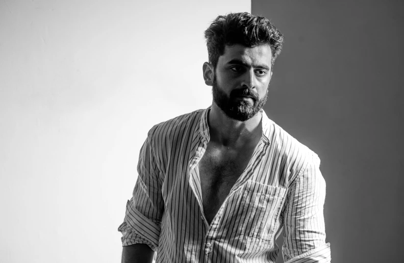 a black and white photo of a man with a beard, by Giorgio Cavallon, riccardo scamarcio, wearing spiky, uploaded, square