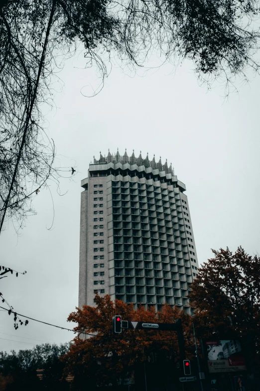 a tall white building with lots of windows on top