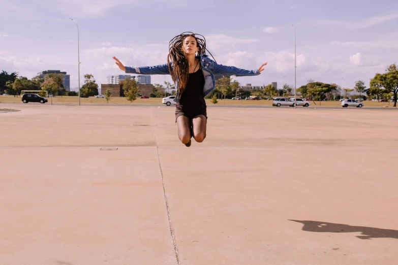 a woman flying through the air while riding a skateboard, pexels contest winner, happening, standing in a parking lot, dancer, sydney park, standing triumphant and proud