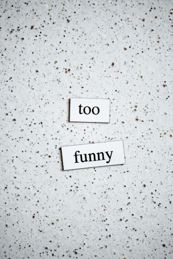 two pieces of paper with the words too funny on them, by Thomas Fogarty, trending on unsplash, made of all white ceramic tiles, 2 0 5 0 s, tummy, label