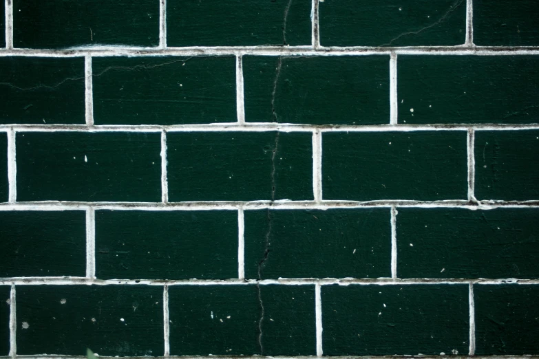 a wall that has some green squares on it