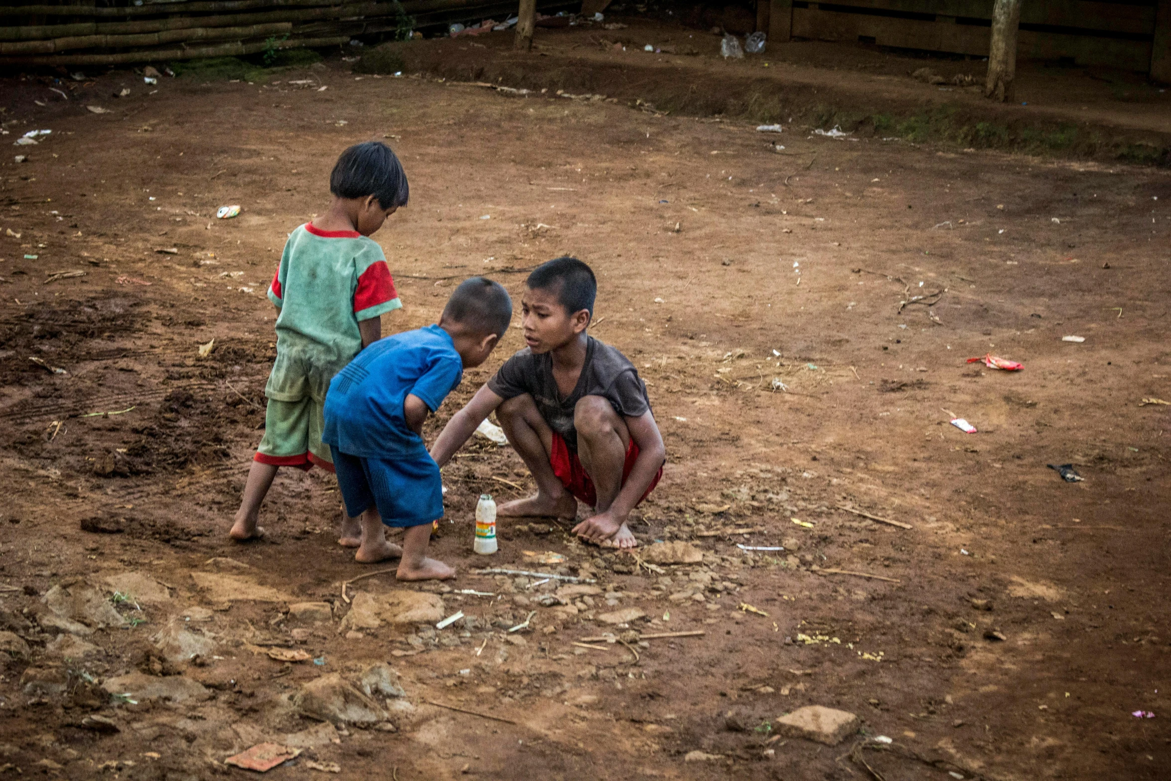 a couple of kids that are standing in the dirt, by Daniel Lieske, pexels contest winner, laos, playing games, 15081959 21121991 01012000 4k, secretly on a village