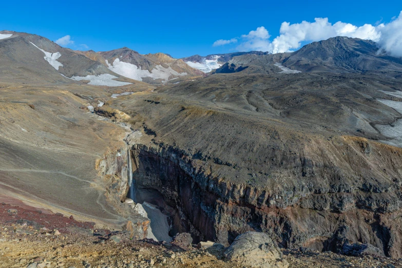 a beautiful scenery with a large mountain range in the distance