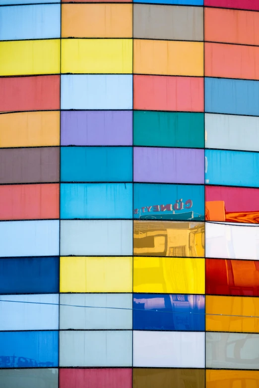 a wall is covered in multiple colored strips