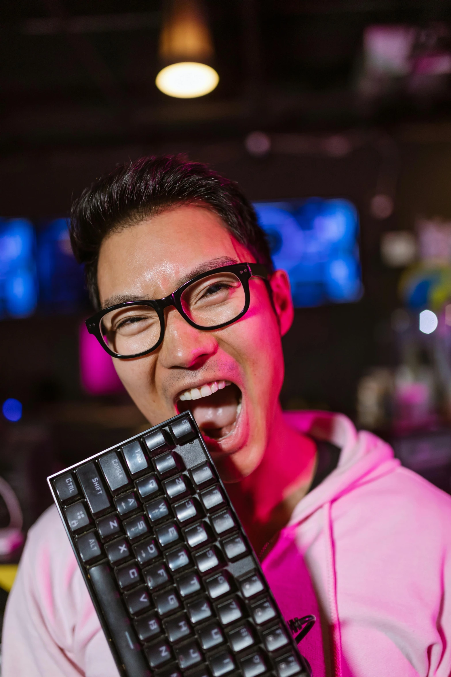 a man holding a keyboard in front of his face, inspired by Jang Seung-eop, reddit, happening, made of candy, at a bar, smileing nright, portrait shot 8 k