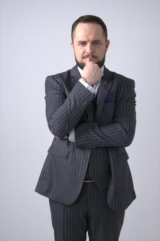 a man in a suit posing for a picture, style of marcin blaszczak, twitch streamer / gamer ludwig, thinking pose, pinstripe suit