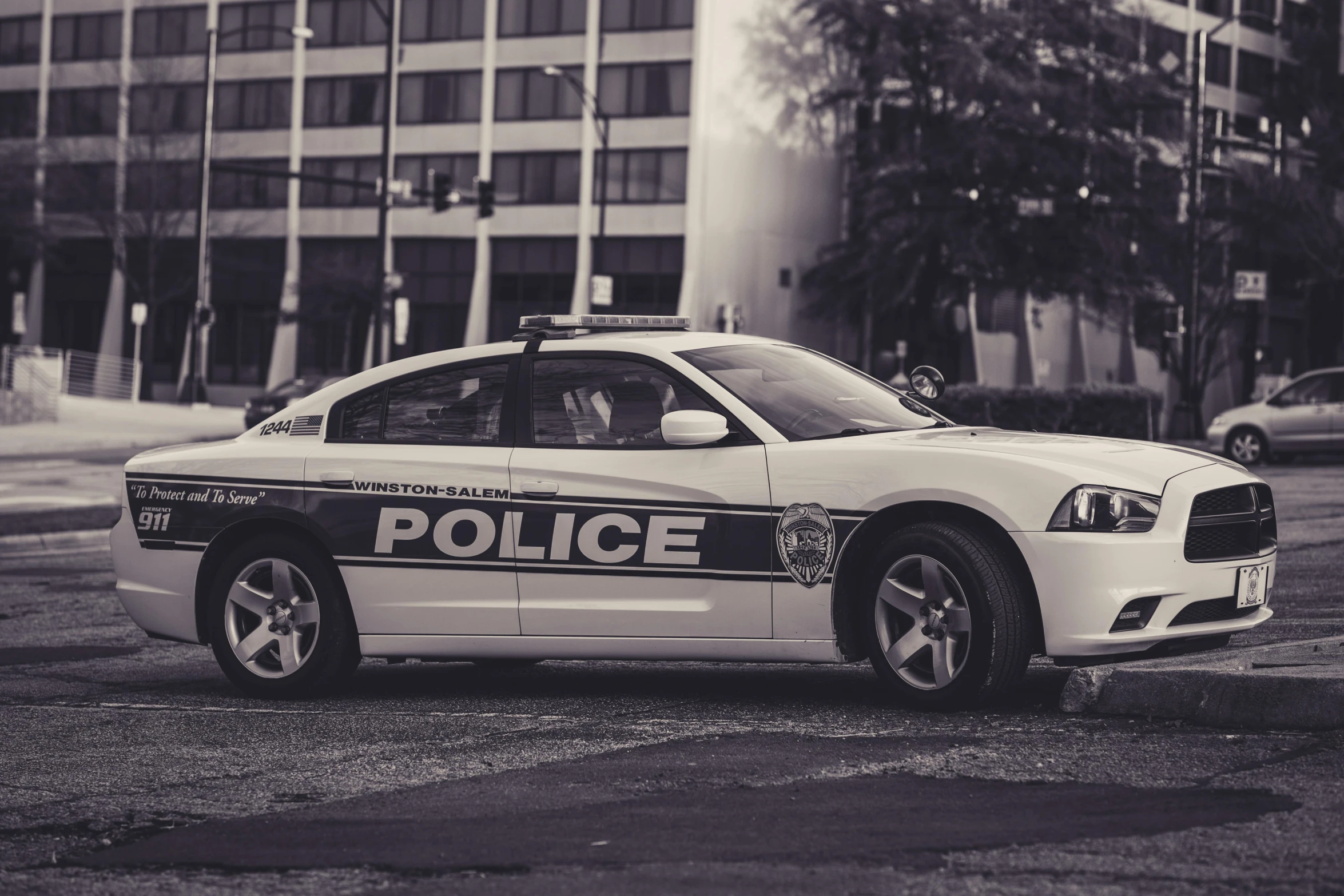 the police car is parked in the lot