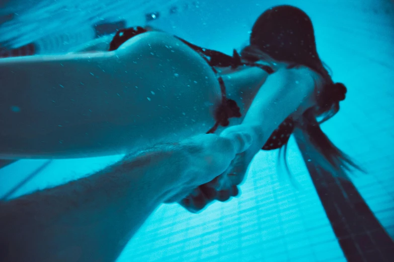 a man and a woman holding hands under water, a picture, leg and hip shot, dreampool rooms, micro pov, submissive