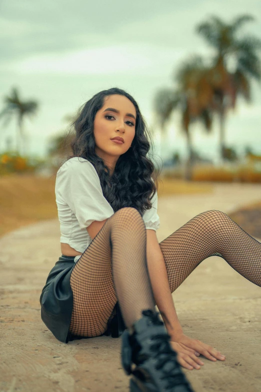 a woman sitting on the ground with her legs crossed, by Ric Estrada, pexels contest winner, realism, wearing fishnets, beautiful young asian woman, gif, wavy