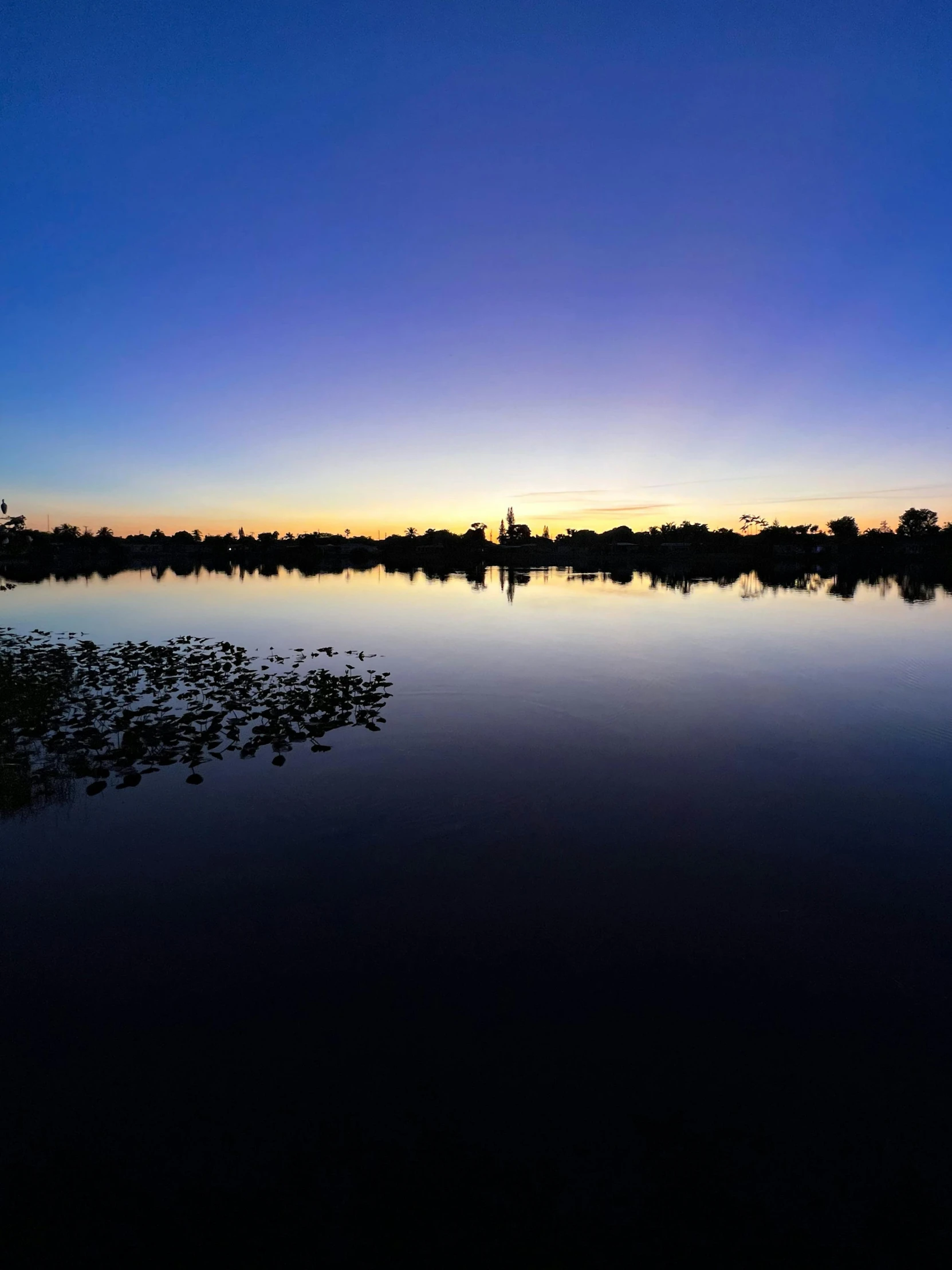 a body of water with a sunset in the background, parks and lakes, ultra wide angle shot, night time photograph, today\'s featured photograph 4k