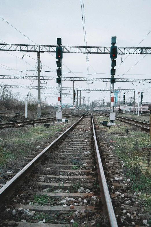 a couple of train tracks sitting next to each other, rostov, cables everywhere, low quality photo, 2022 photograph