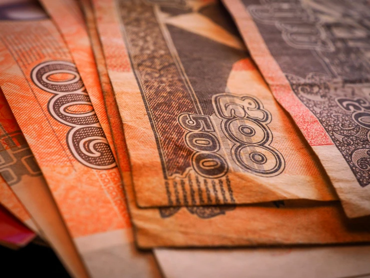 a pile of money sitting on top of a table, warm coloured, australia intricate, 000 — википедия, neo norilsk