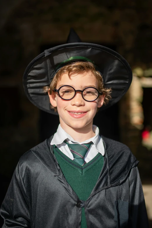 a  wearing a witches hat and a green tie