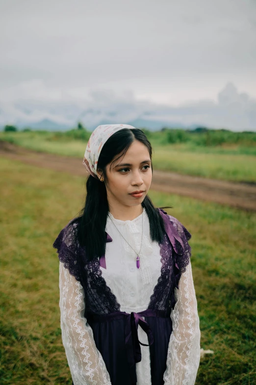 an image of a woman wearing a dress in a field