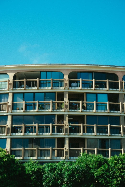 a large apartment building has balconies on each level