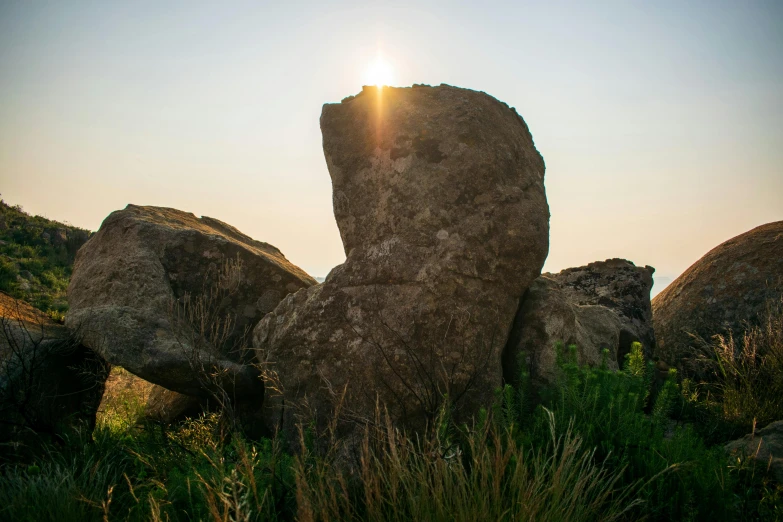 the sun is peeking through the stones