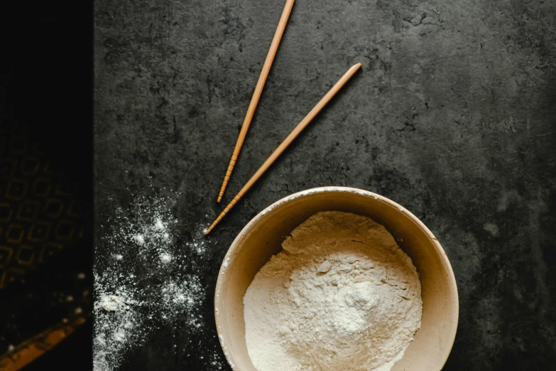 a bowl of flour with chopsticks next to it, unsplash, background image, instagram picture, made of glazed, fan favorite