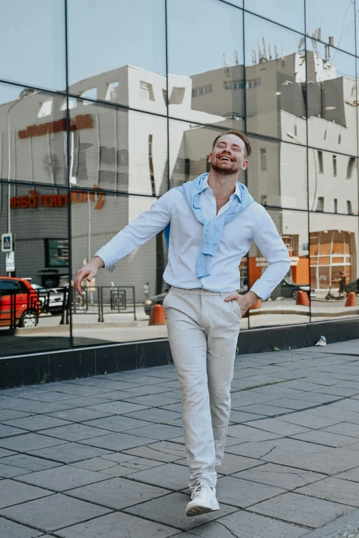 the man is walking on a brick sidewalk