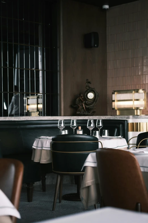 a dining room filled with lots of tables and chairs, a portrait, inspired by Barthélemy Menn, trending on unsplash, cinematic detail, gourmet michelin restaurant, thumbnail, brass and steam technology
