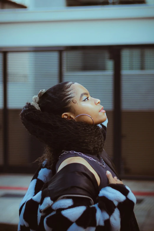 a woman standing in front of a building, trending on pexels, afrofuturism, black ponytail, teenage girl, wearing turtleneck, peaceful mood