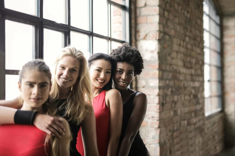 a group of women standing next to each other, by Nina Hamnett, pexels, happening, redahair and attractive features, dancers, 15081959 21121991 01012000 4k, smiling at camera