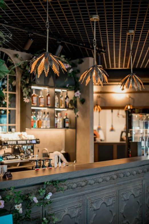 three lights hanging from the ceiling at a restaurant