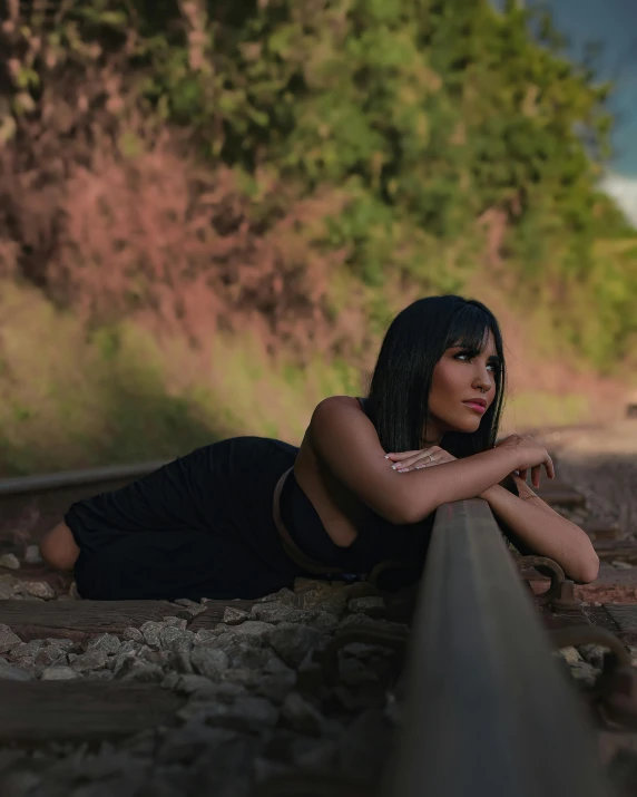 a beautiful young woman laying on a train track, by Robbie Trevino, cindy avelino, trending photo, proud looking away, leaked photo