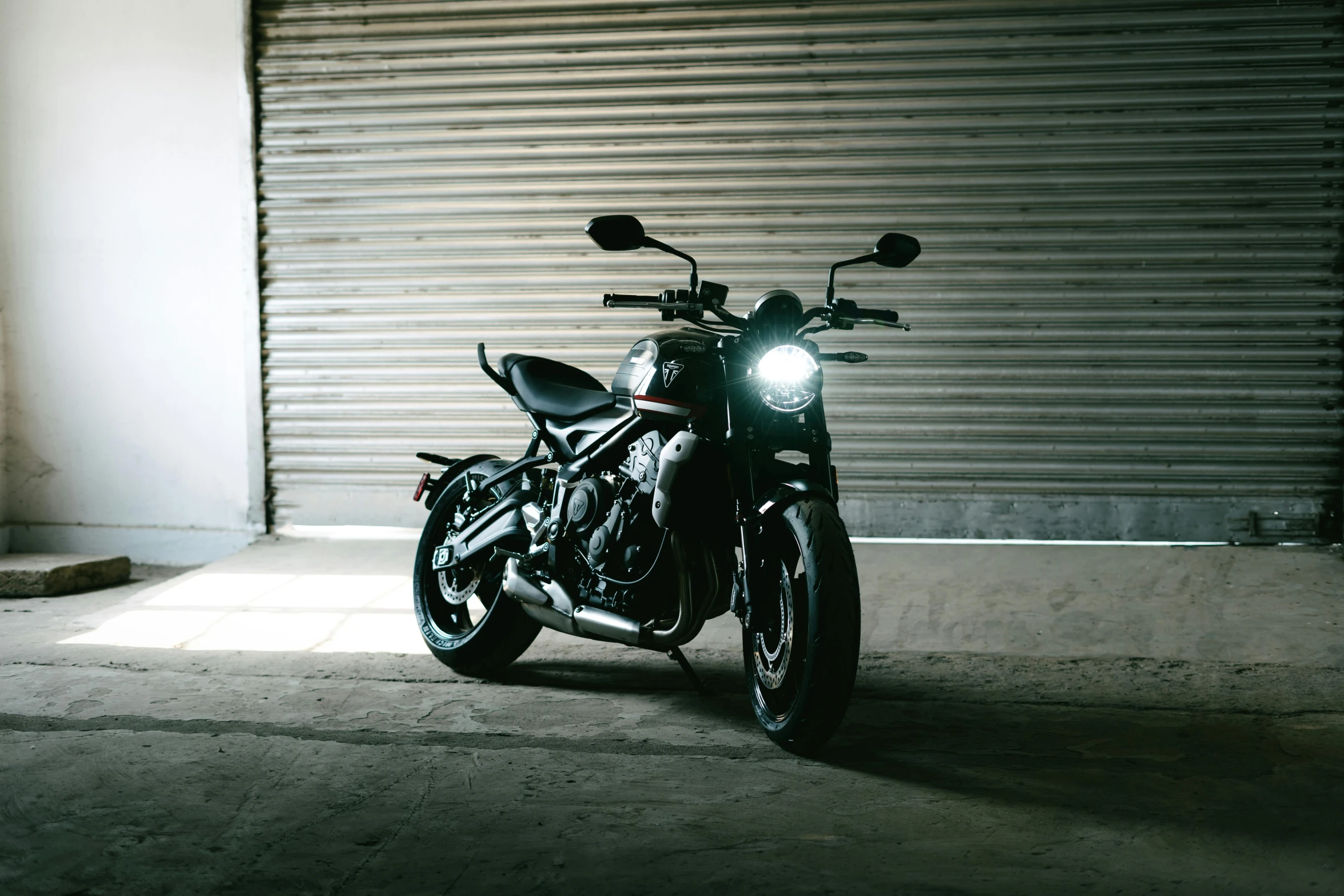 motorcycle parked in front of the garage door