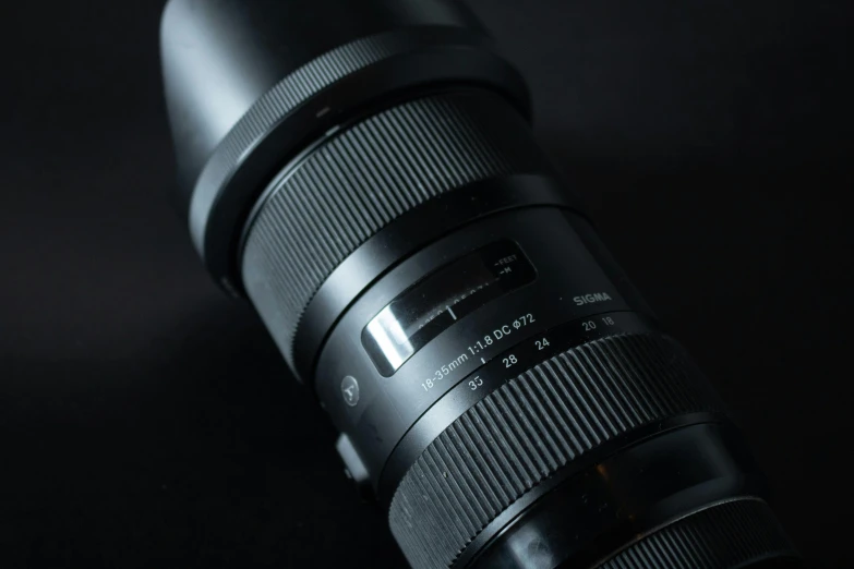 a close up of a camera lens on a table, unreal engine. sigma 35mm, high quality product image”, profile shot, long lens