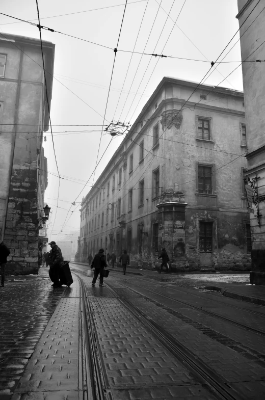 a black and white photo of people walking down a street, a black and white photo, inspired by Kazimierz Alchimowicz, dusty library, :: morning, wintertime, covered with wires