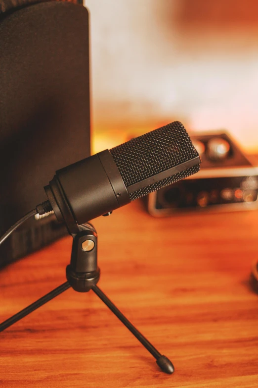 a microphone sitting on top of a wooden table, on a desk, thumbnail, gaming, f / 2 0