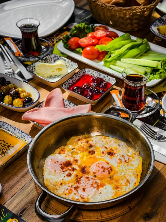 a wooden table topped with lots of food, dau-al-set, eggs, profile image, gourmet restaurant, square