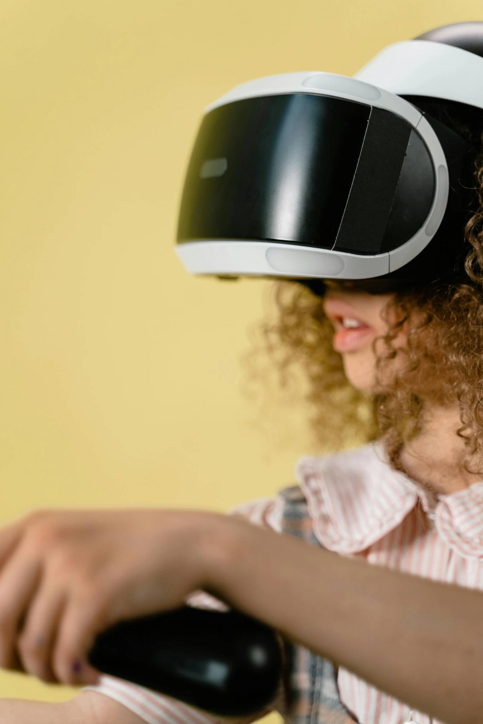 a woman with curly hair wearing a virtual reality headset, close-up of a robot sitting down, avatar image, archviz, children's